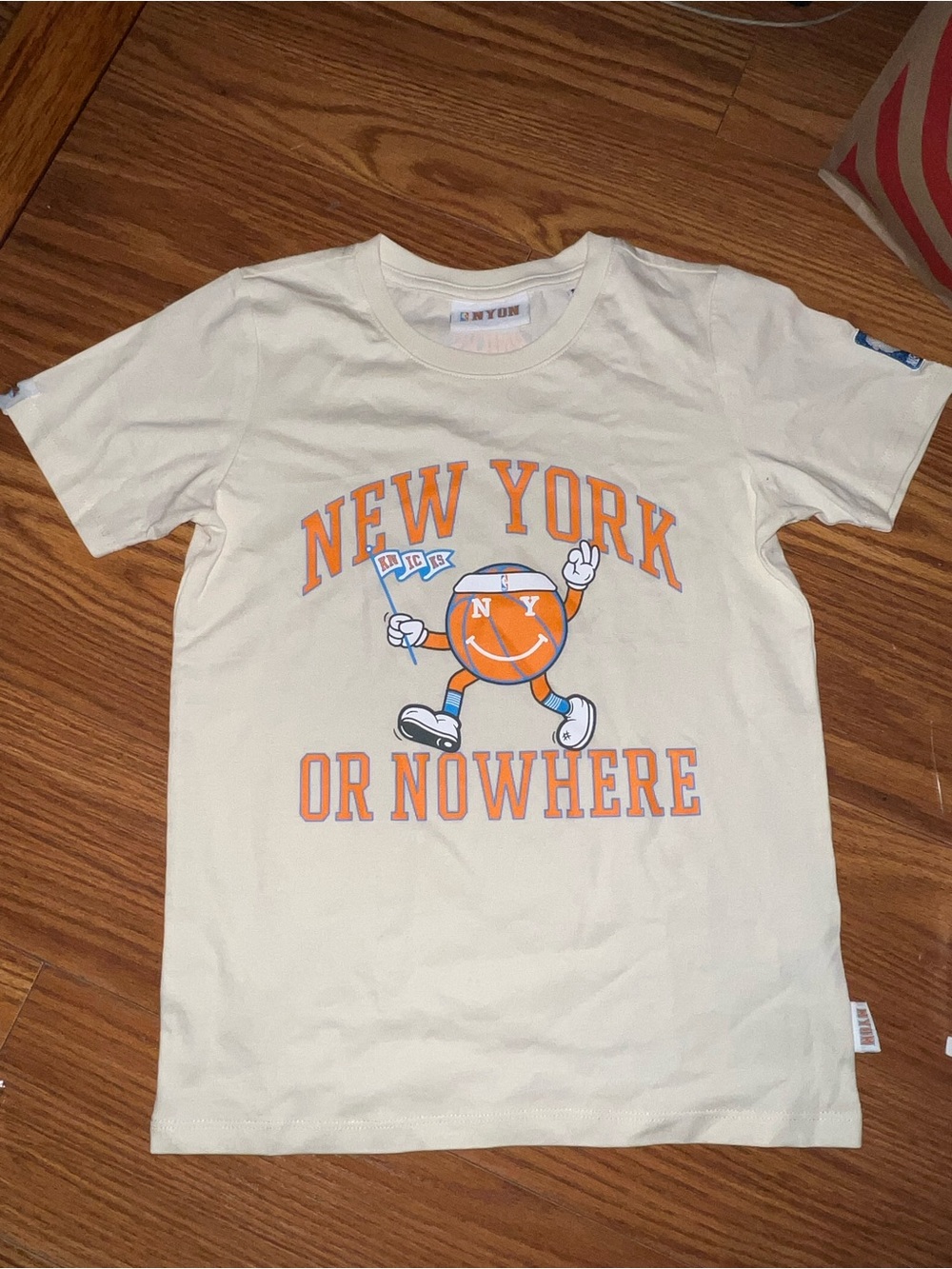 'New York or Nowhere' Mr. Knick 2024 Playoff Tee Cream Graphic Tee